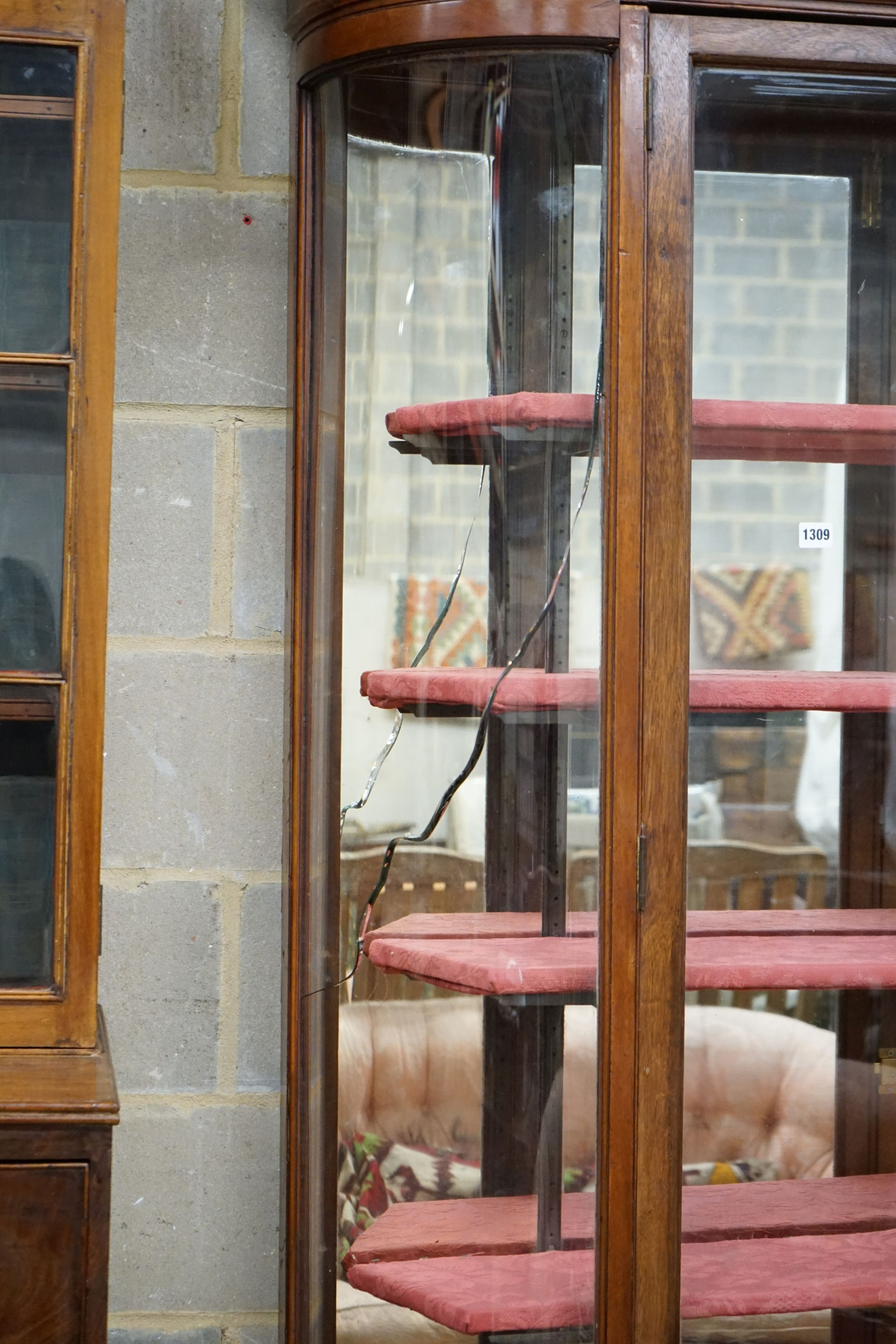 A Victorian mahogany shop display cabinet on later base, width 150cm, depth 32cm, height 209cm